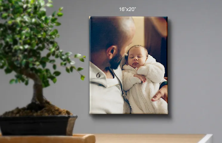 Tela 48x36 di padre che tiene in braccio il bambino